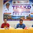 Kepala OJK Papua, Fatwa Aulia bersama Pj Sekda Provinsi Papua Tengah, dr. Silwanus Sumule dalam rapat TPAKD di Nabire / Istimewa